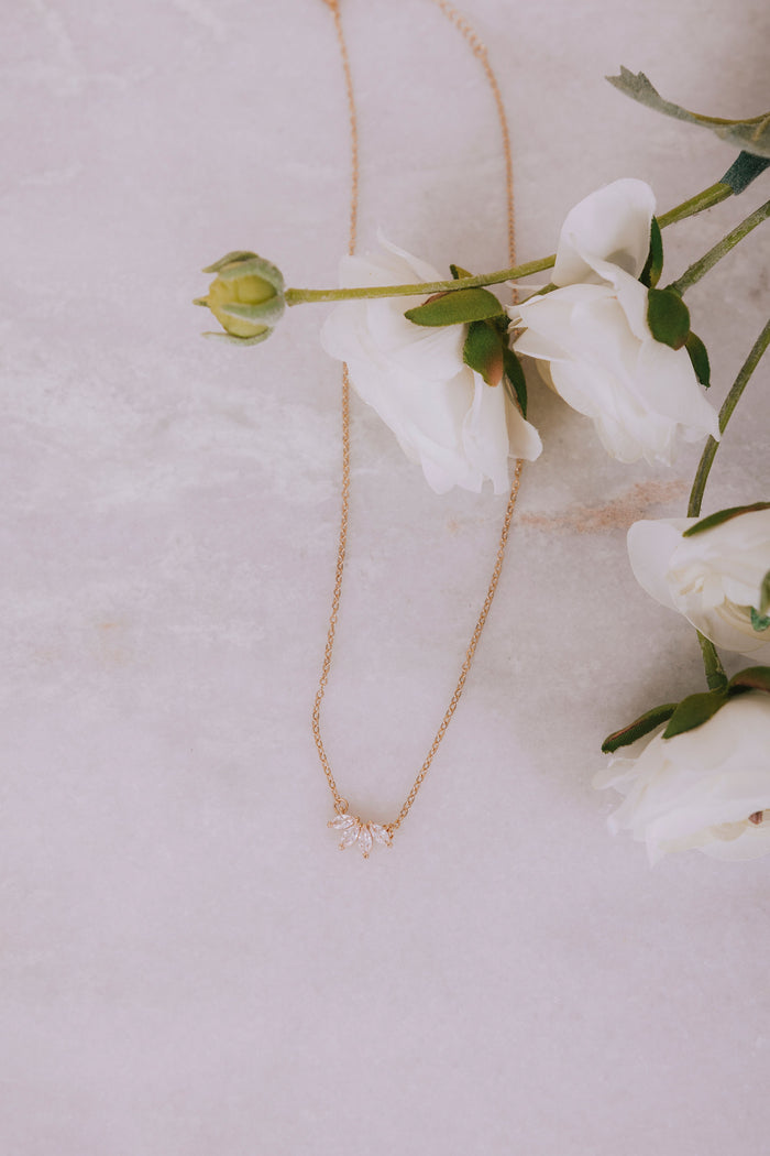 four leaf zirconia necklace flatlay