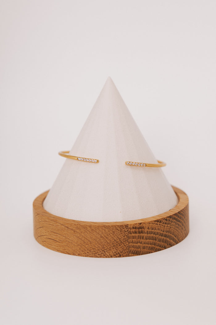 gold open bracelet with diamond details delicate