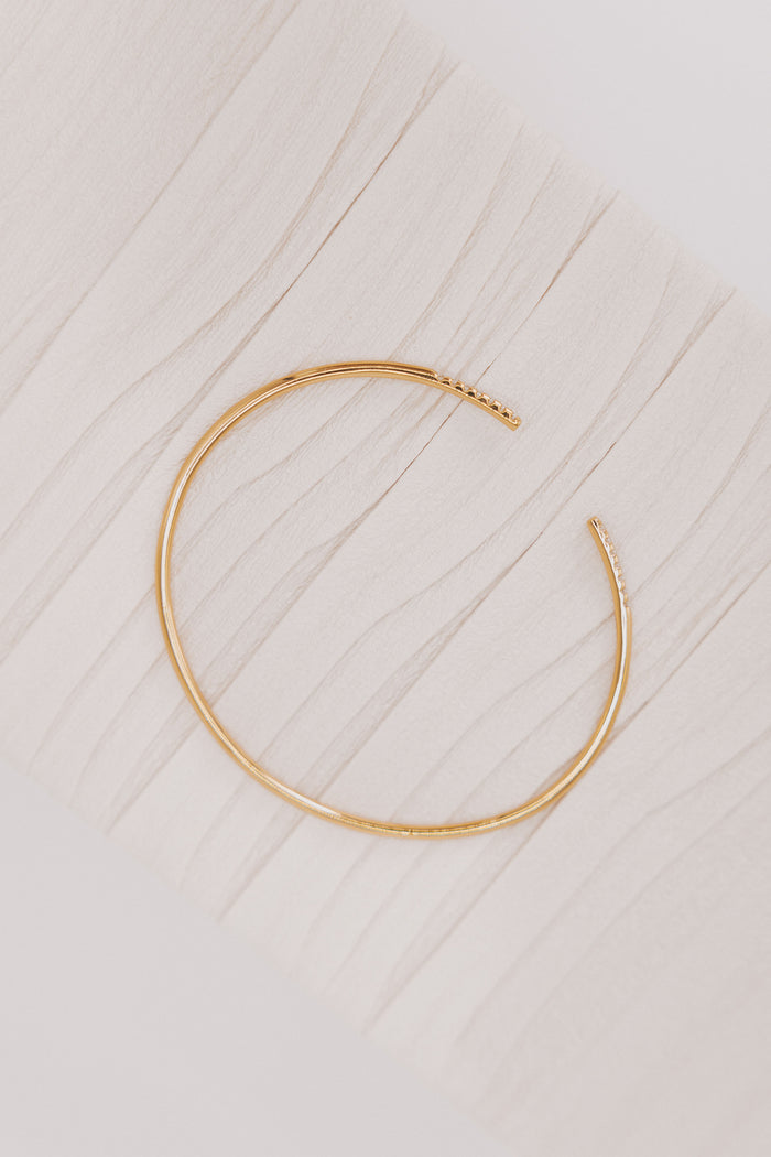 gold open bracelet with diamond details delicate