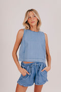 Plain denim sleeveless blouse with a back keyhole and baggy fit.
