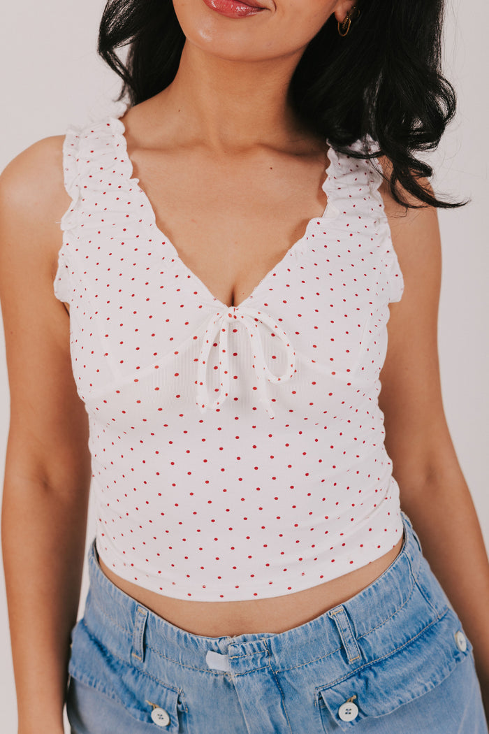 white v neck tank with red polka dots