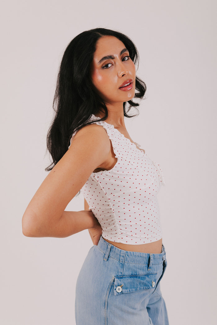 white v neck tank with red polka dots
