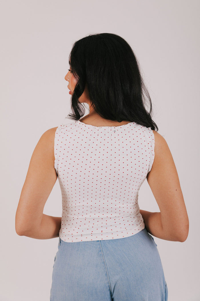 white v neck tank with red polka dots
