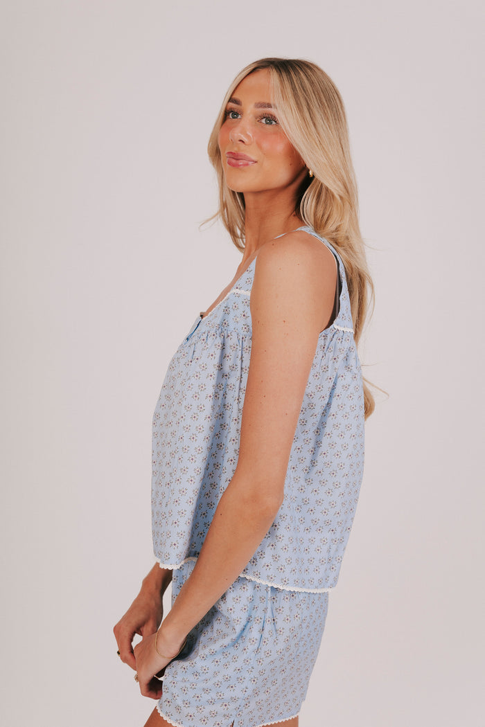 blue floral wide strap tank with white trim and sweetheart neckline