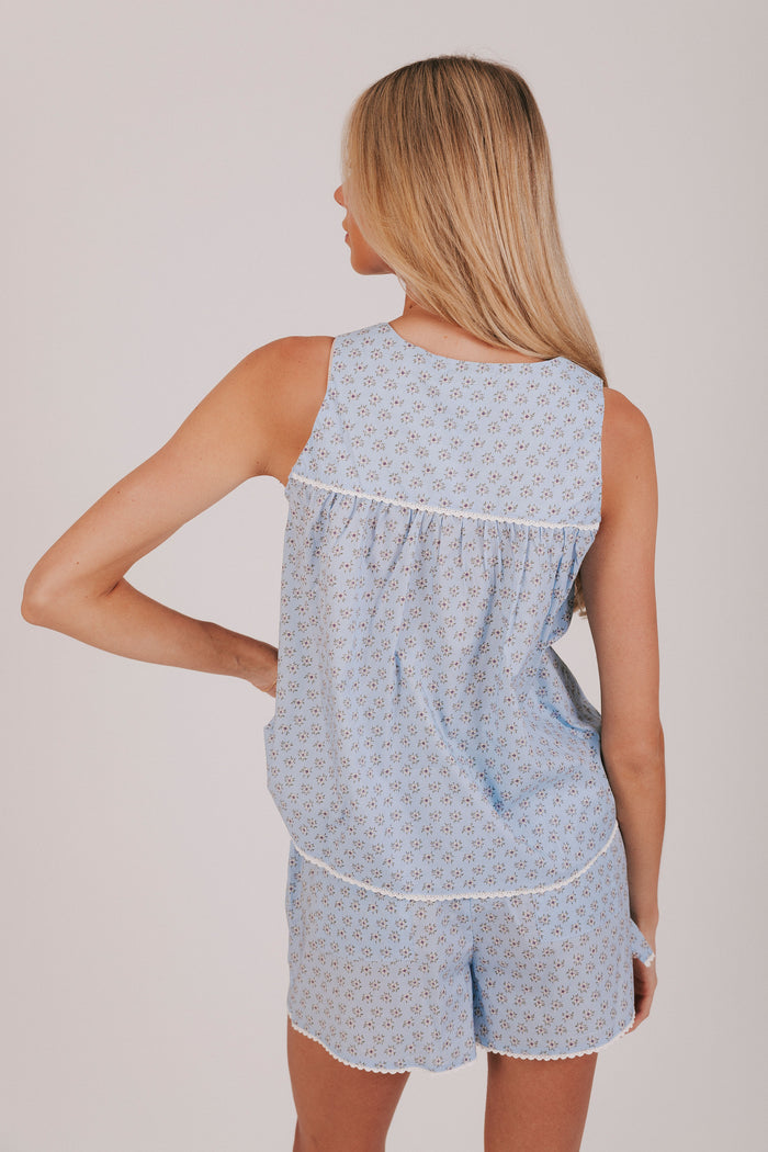 blue floral wide strap tank with white trim and sweetheart neckline