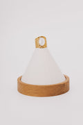 wide gold ring with white stone in center
