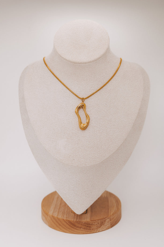 gold necklace with asymmetric pendant