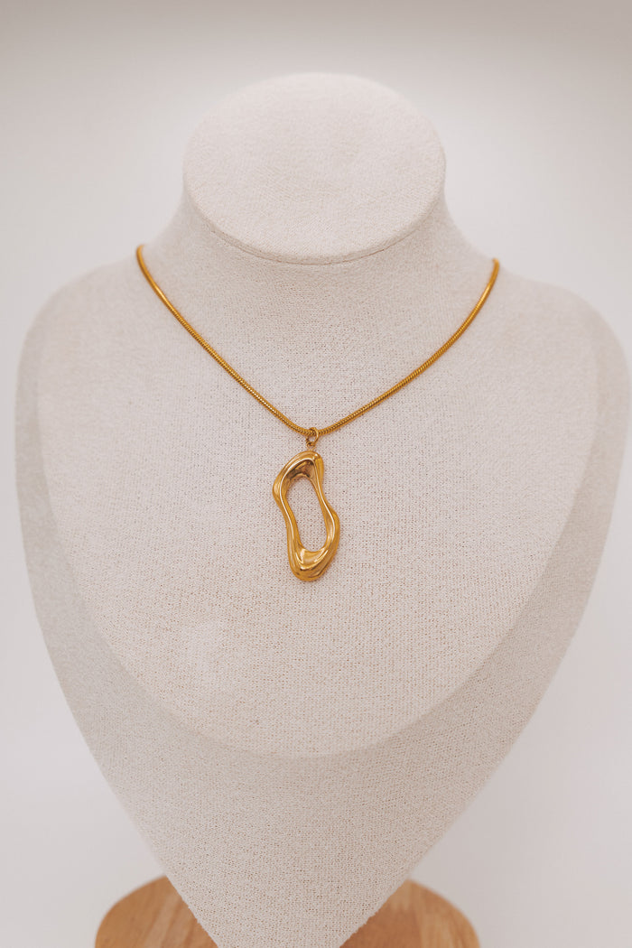 gold necklace with asymmetric pendant
