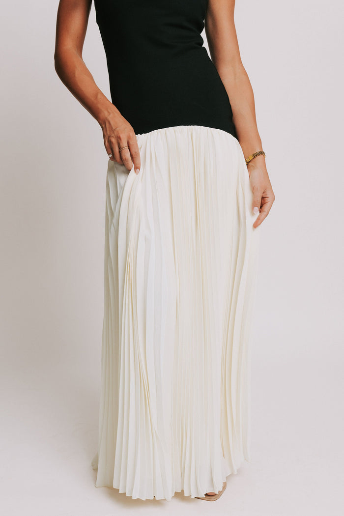 strapless maxi dress with black bodice and white pleated skirt bottom