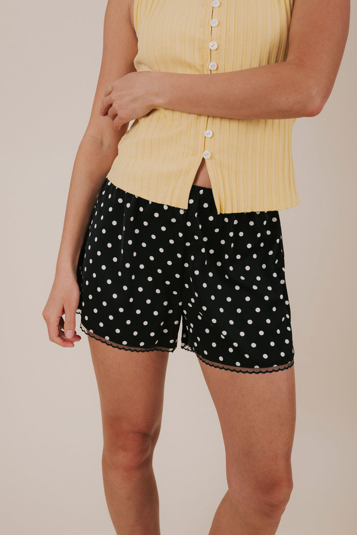 black and white polka dot satin shorts detail
