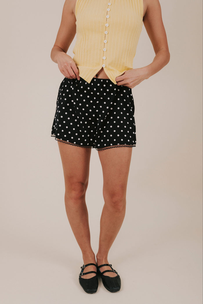 black and white polka dot satin shorts front