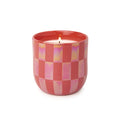 Candle in a red checkered container on a white background