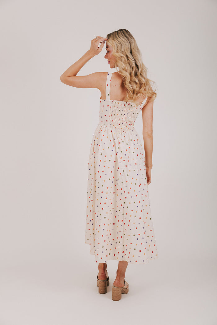 cream dress with multicolored polka dots