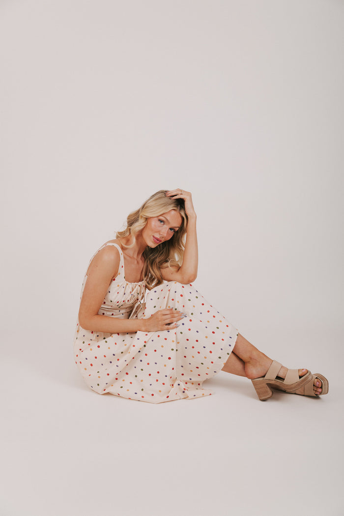 cream dress with multicolored polka dots