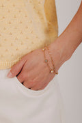 Gold stainless steel bracelet with roman numeral clock face and double layer