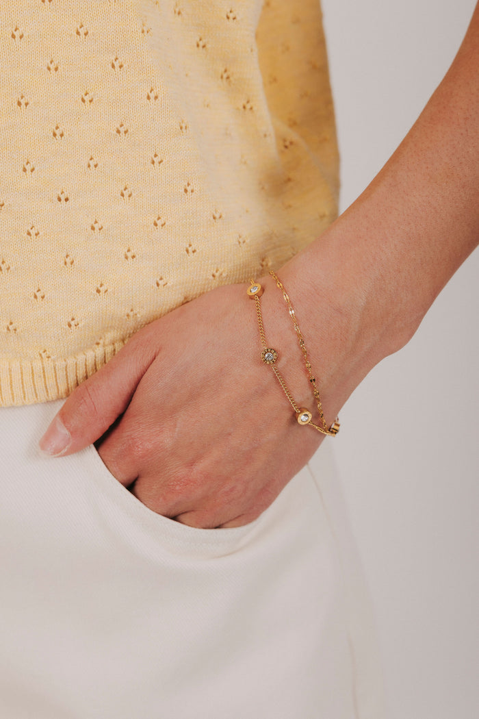 Gold stainless steel bracelet with roman numeral clock face and double layer