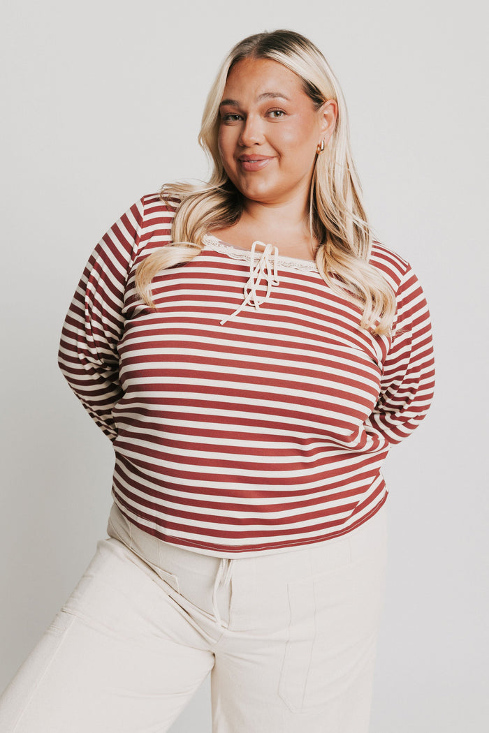 burgundy striped top with lace trim on neckline and sleeves