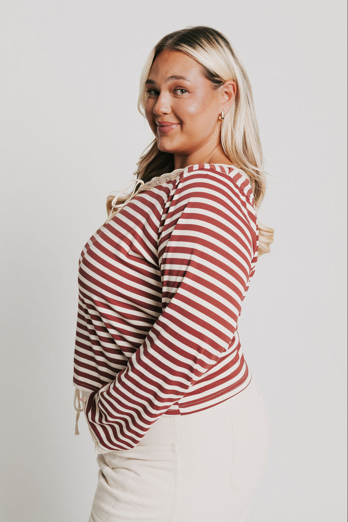 burgundy striped top with lace trim on neckline and sleeves side