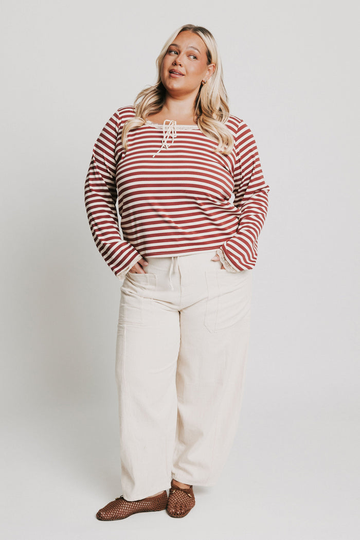 burgundy striped top with lace trim on neckline and sleeves full