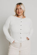 white long sleeve top with buttons and lace trim on neckline