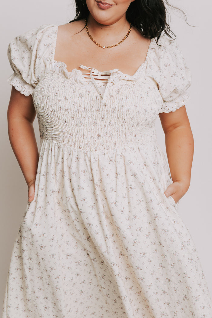 ivory floral dress with lace up detail and eyelet trim plus front