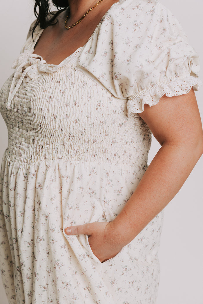 ivory floral dress with lace up detail and eyelet trim plus side bodice