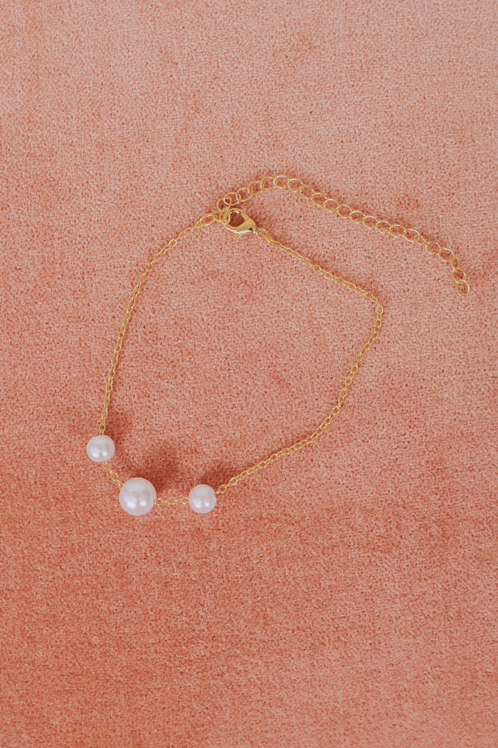 3 pearl simple gold bracelet flatlay