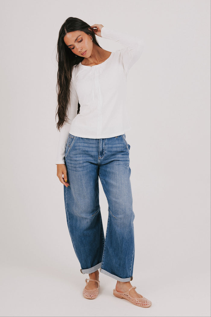 white long sleeve top with lace detail and bow