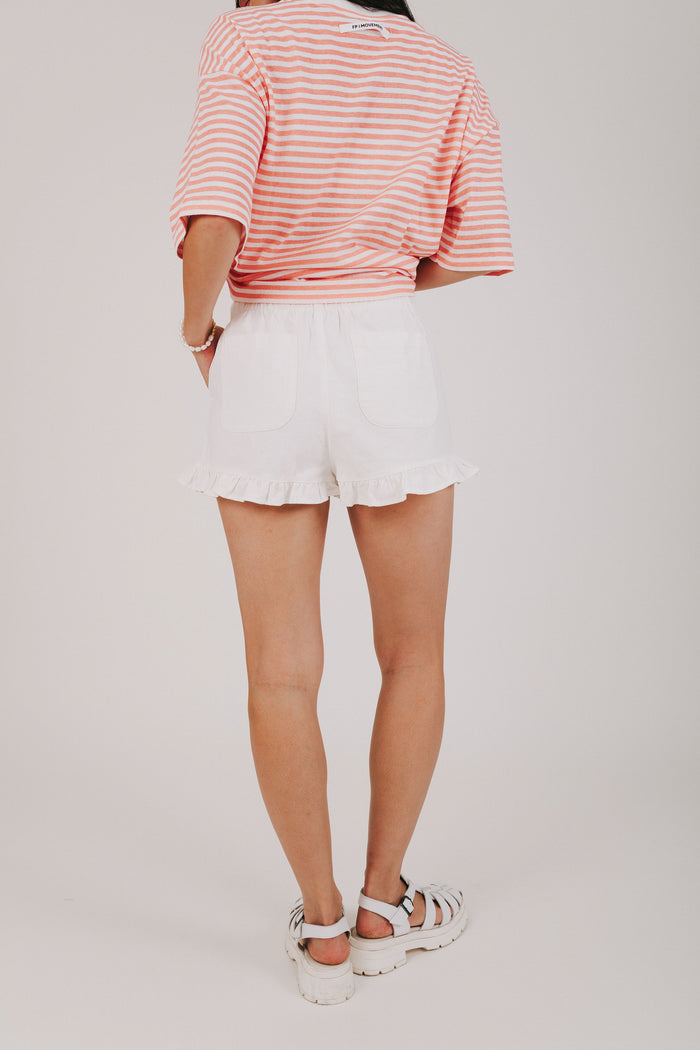 white cotton shorts with ruffled hem back