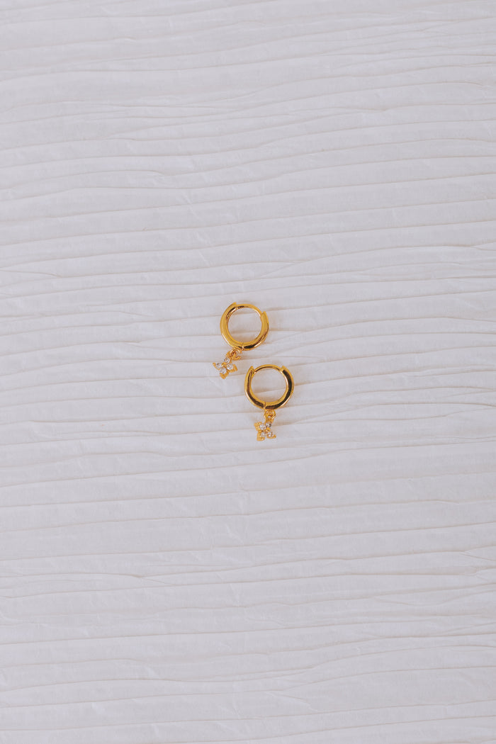 14K gold plated earring. Hoop with huggie closure, cubic zirconia flower clover dangle