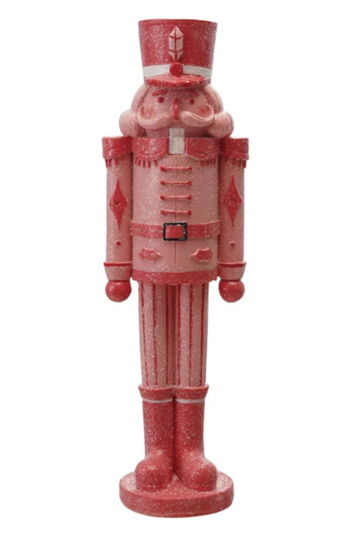 Decorative red nutcracker figure on a white background