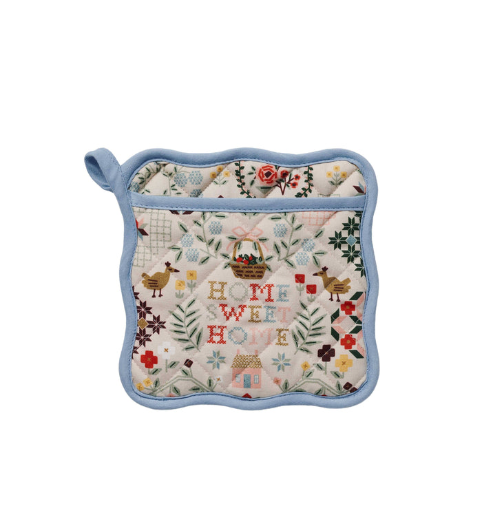 Potholder with 'Home Sweet Home' text and floral patterns on a white background