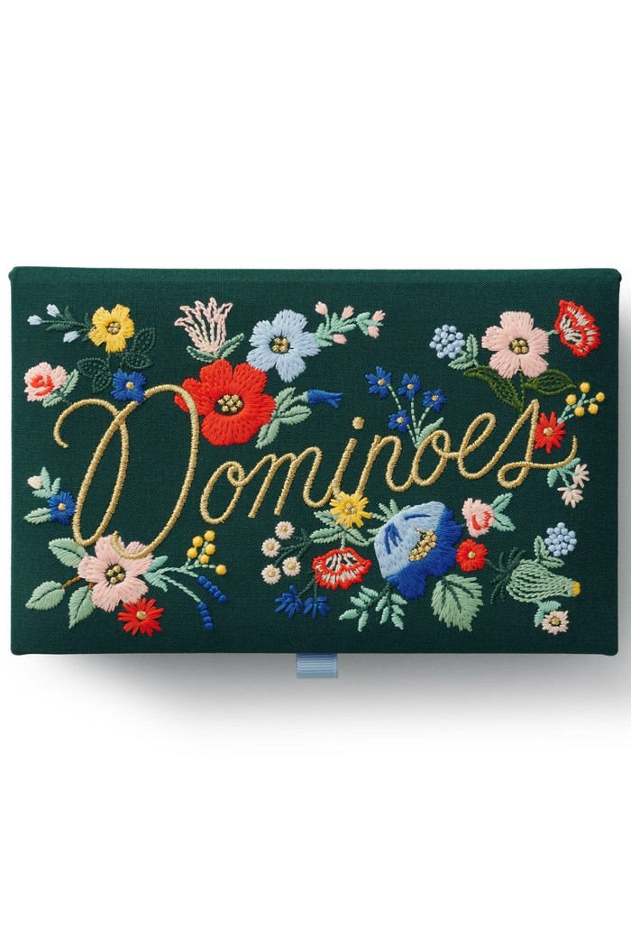 Set of dominoes in a floral embroidered box.