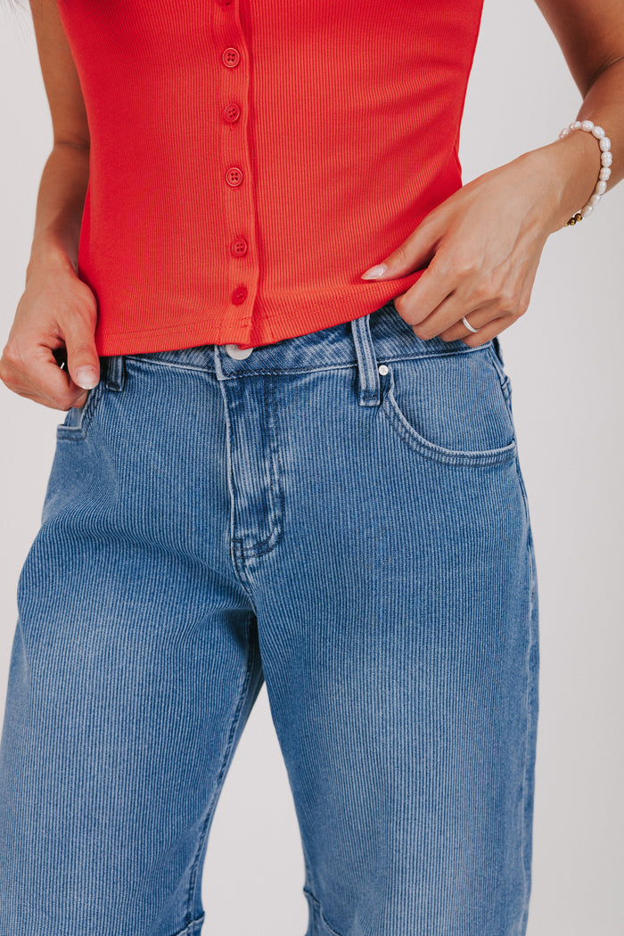medium wash textured barrel jeans waistline