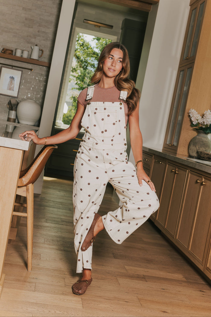 cream overalls with brown polka dots lifestyle
