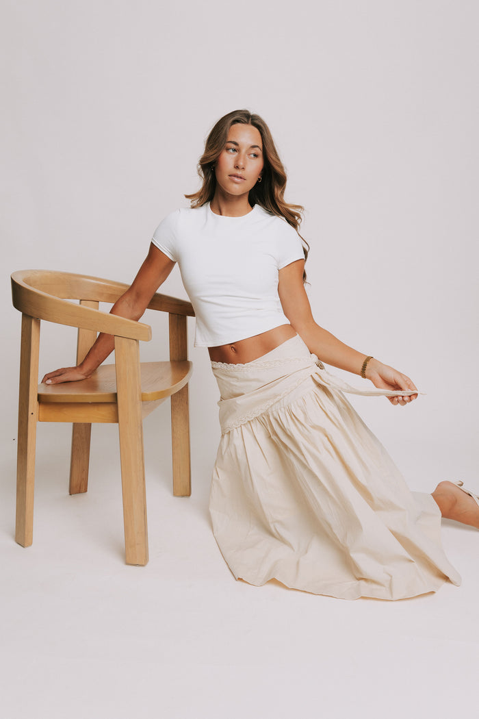 beige midi skirt with lace tie detail pose