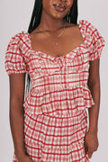 red plaid peplum top with puffed sleeves