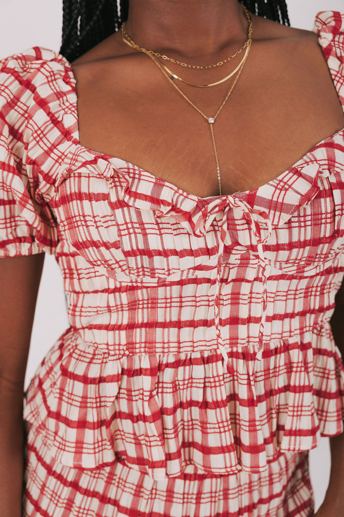 red plaid peplum top with puffed sleeves