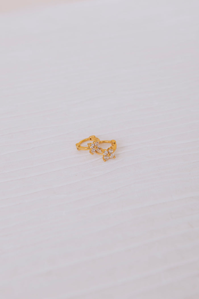 cubic zirconia floral huggie earrings flatlay