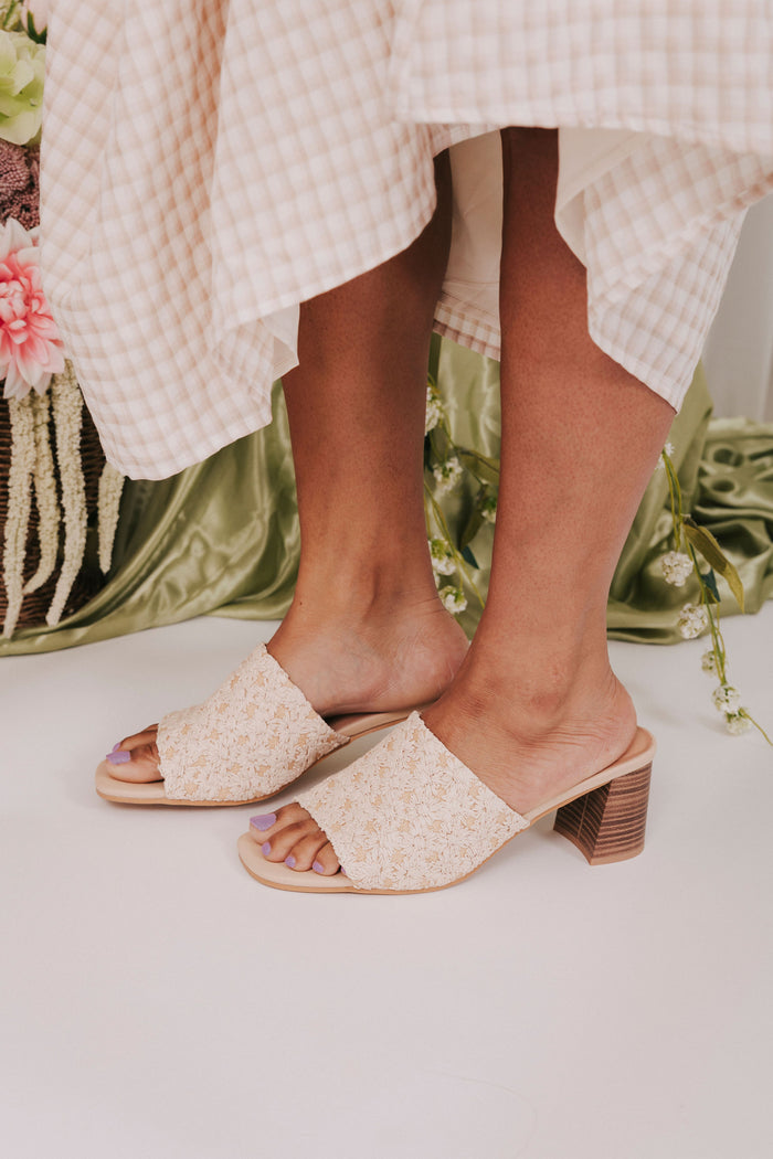 woven raffia shoes with daisy pattern heels