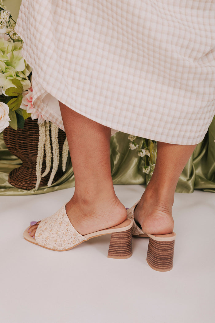 woven raffia shoes with daisy pattern heels