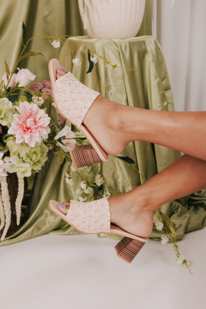 woven raffia shoes with daisy pattern heels