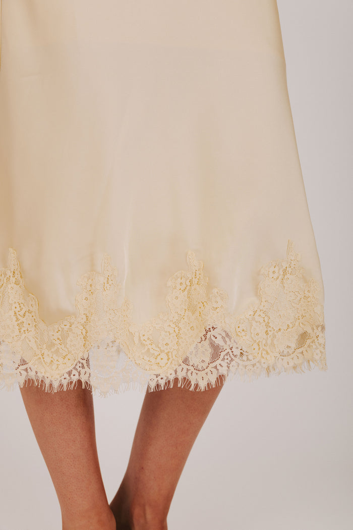 butter yellow satin midi skirt with lace trim
