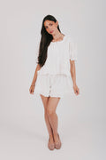 White top and shorts set with a puff sleeve blouse and elastic waistband shorts