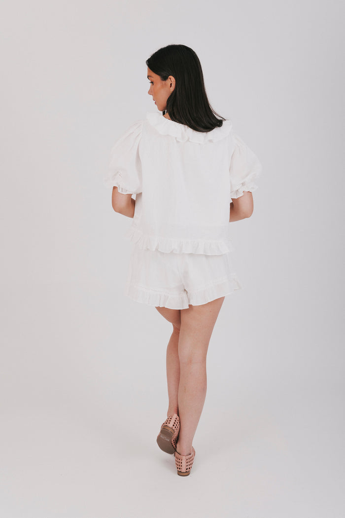 White top and shorts set with a puff sleeve blouse and elastic waistband shorts