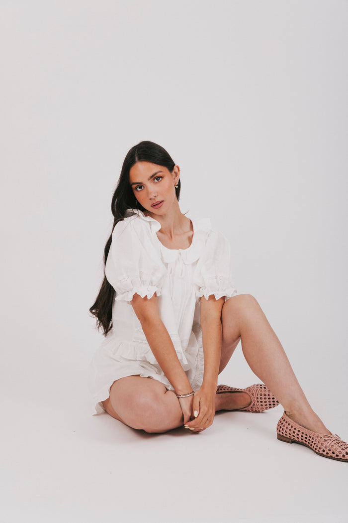 White top and shorts set with a puff sleeve blouse and elastic waistband shorts