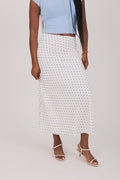 white skirt with blue polka dots