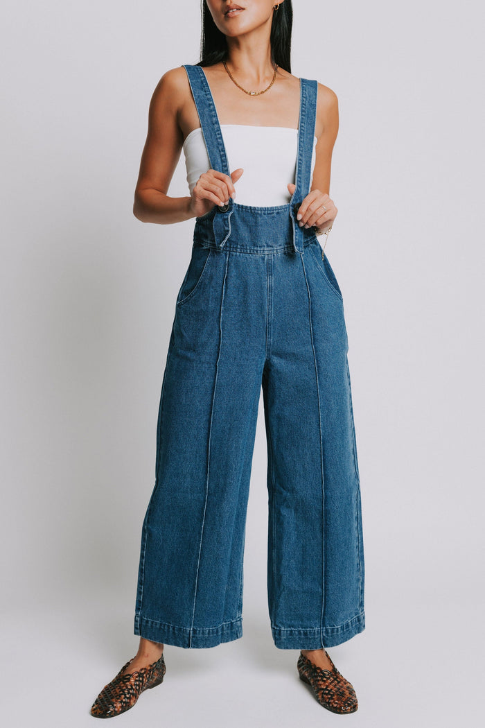 denim suspender jumpsuit with seamed detailing front