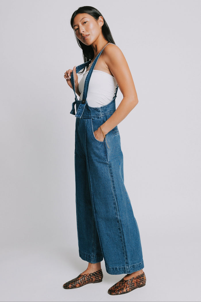 denim suspender jumpsuit with seamed detailing side