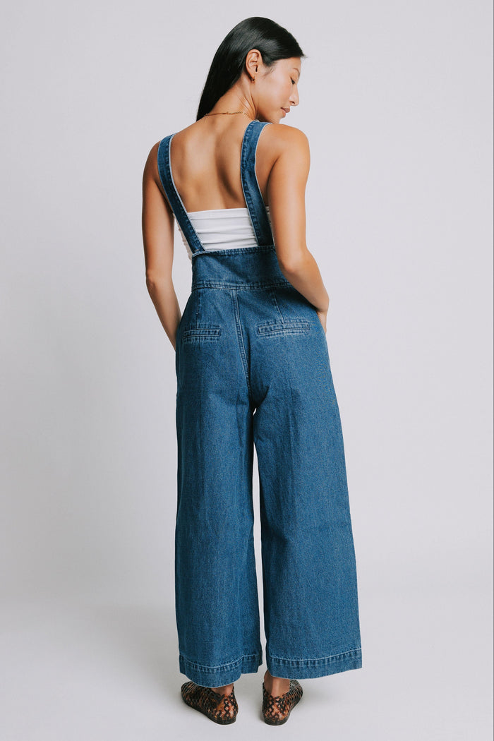 denim suspender jumpsuit with seamed detailing back